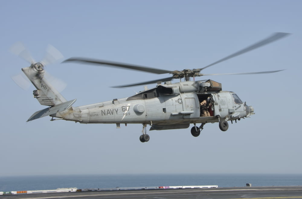 An SH-60F Seahawk embarked aboard USS Theodore Roosevelt Canvas Art - Giovanni CollaStocktrek Images (17 x 12)