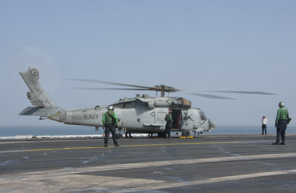 An SH-60F Seahawk embarked aboard USS Theodore Roosevelt Canvas Art - Giovanni CollaStocktrek Images (34 x 23)