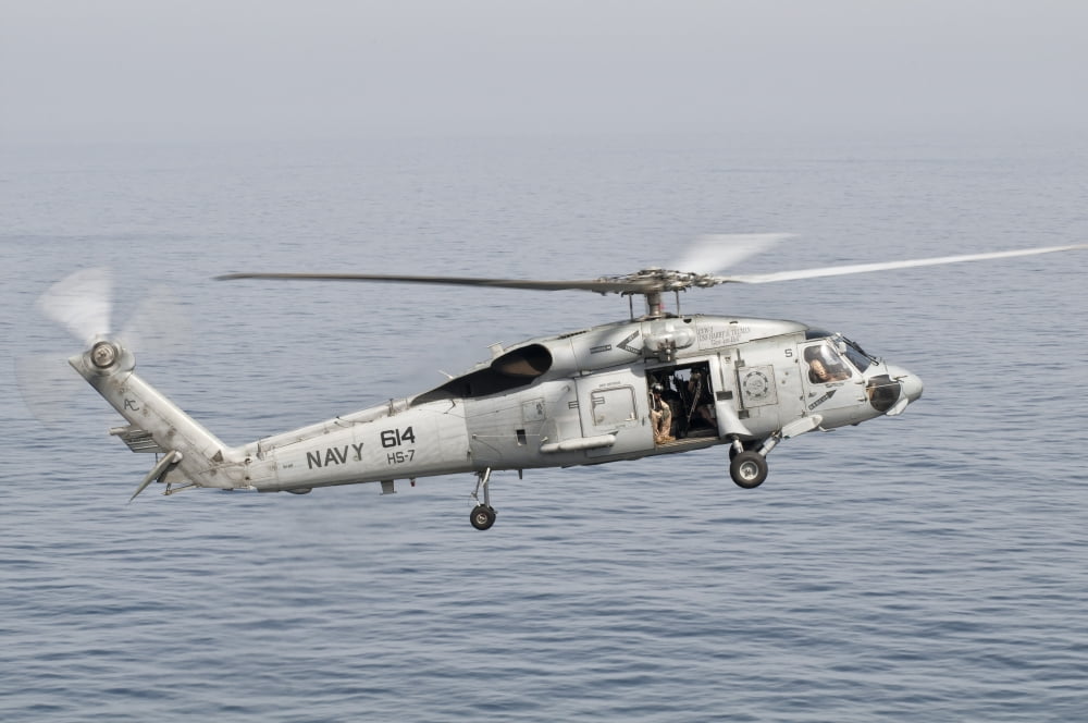 An SH-60F Seahawk gets airborne from the deck of USS Harry S Truman Canvas Art - Giovanni CollaStocktrek Images (35 x 23)