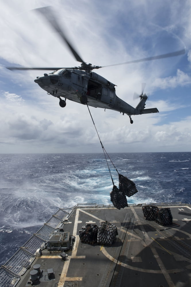 An SH-60S Sea Hawk delivers supplies on the flight deck fo USS Preble Canvas Art - Stocktrek Images (23 x 35)