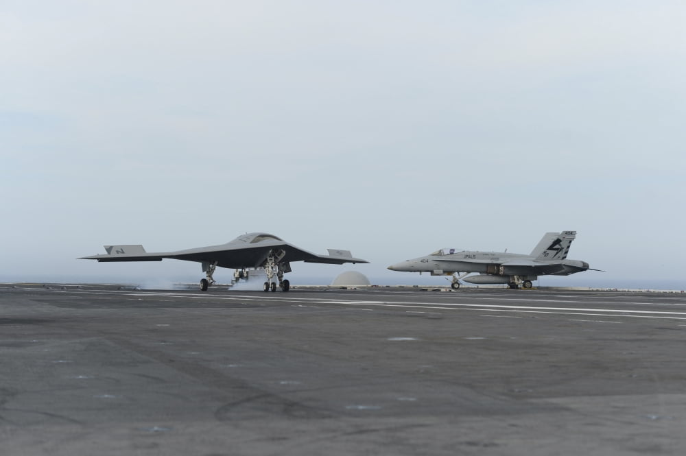 An X-47B unmanned combat air system conducts a touch and go landing Canvas Art - Stocktrek Images (35 x 23)