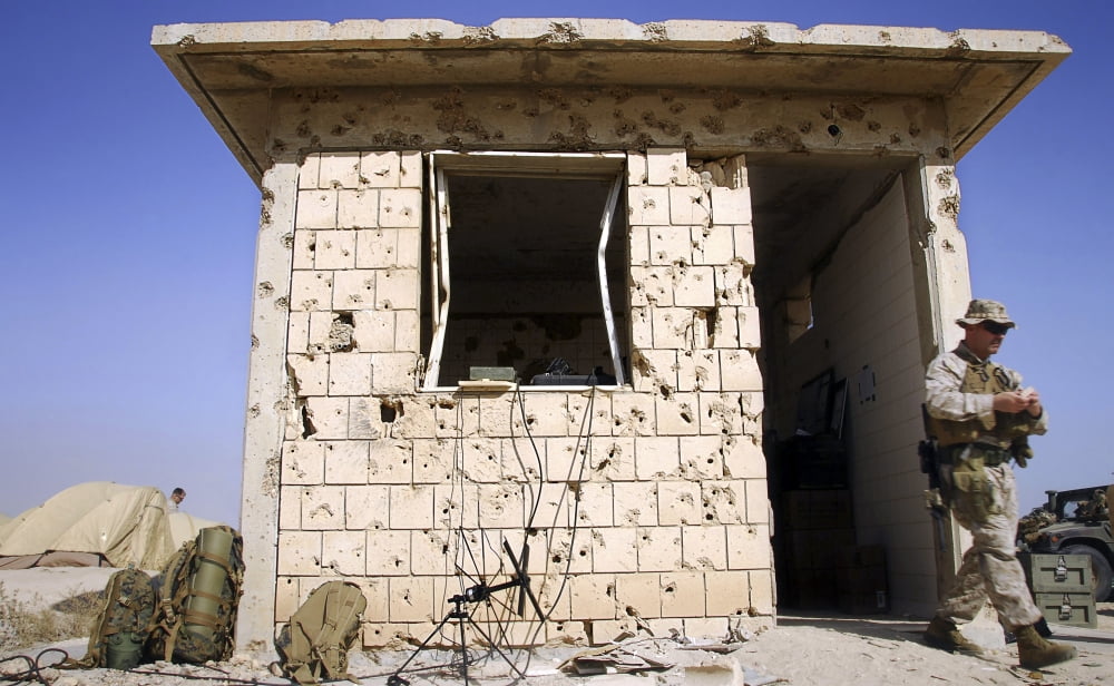 An abandoned structure pocked by bullets serves as an operations center Canvas Art - Stocktrek Images (36 x 22)