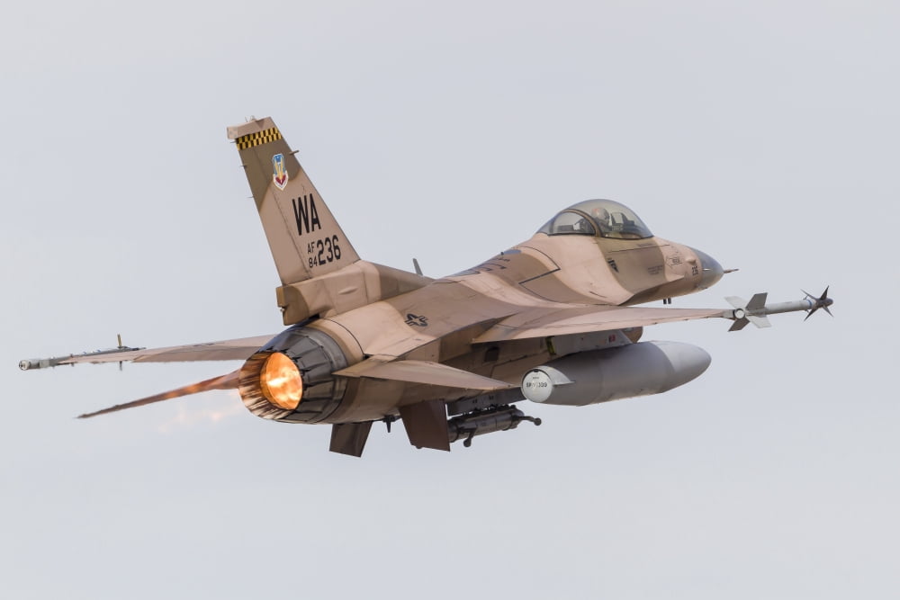 An aggressor F-16C Fighting Falcon of the US Air Force Canvas Art - Rob EdgcumbeStocktrek Images (34 x 23)