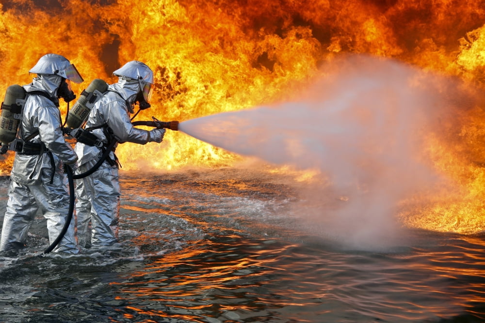 An aircraft rescue firefighting team attempts to spray out a fuel fire Canvas Art - Stocktrek Images (34 x 23)