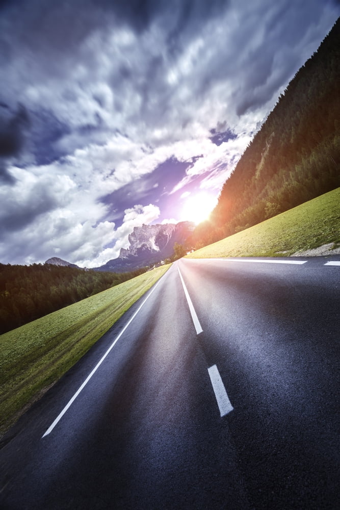An asphalt road leading to the Dolomite Alps at sunset Northern Italy Canvas Art - Evgeny KuklevStocktrek Images (23 x 35)