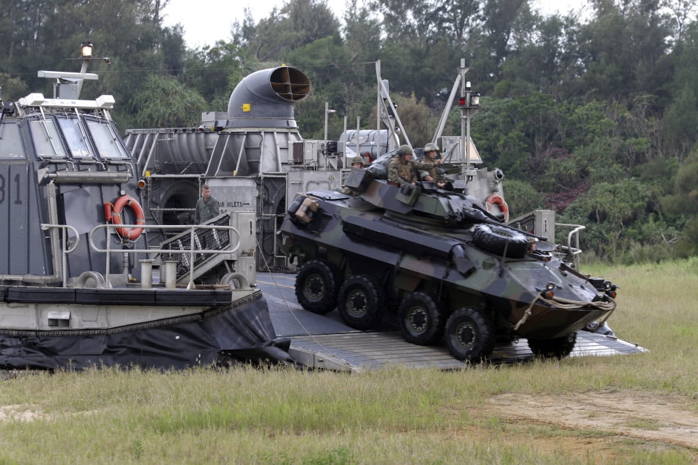 An assault amphibious vehicle exits a landing craft air cushion Canvas Art - Stocktrek Images (34 x 23)