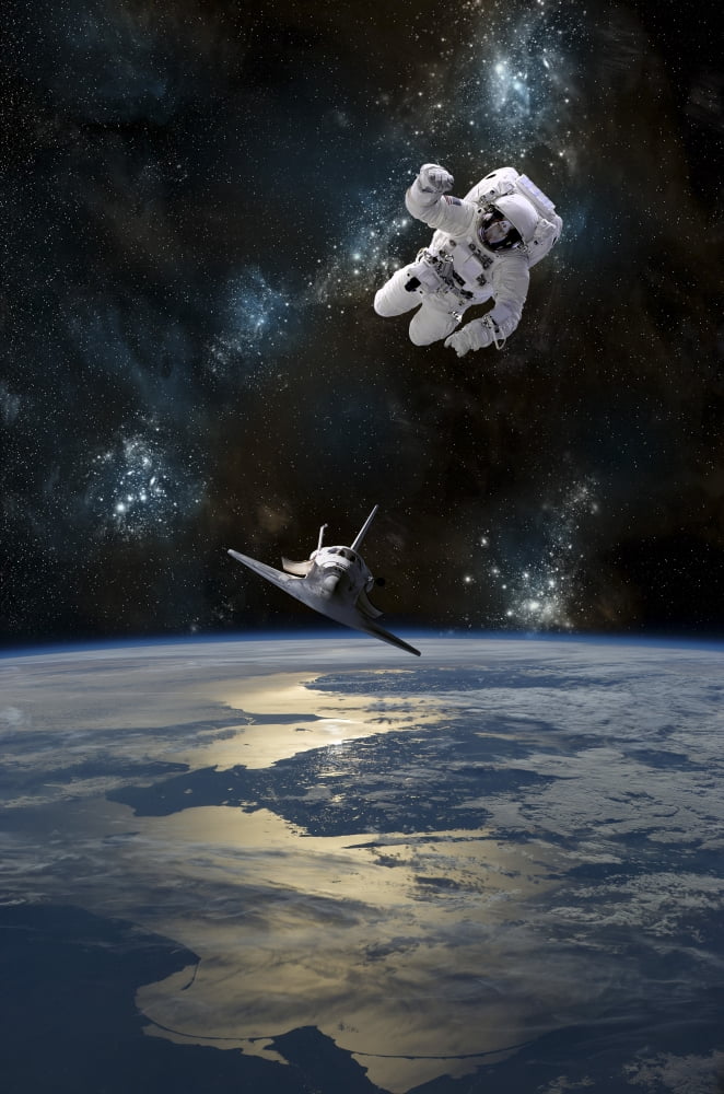 An astronaut drifting in space is rescued by a space shuttle orbiting Earth Canvas Art - Marc WardStocktrek Images (23 x 35)
