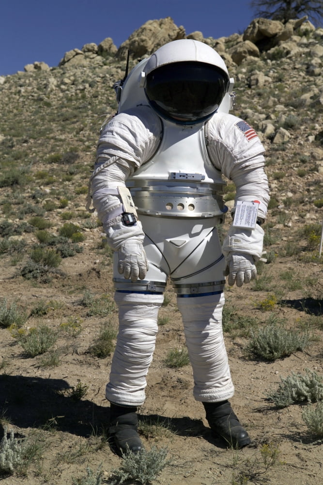 An astronaut equipped with a Mark-III suit takes a stroll in the desert Canvas Art - Stocktrek Images (23 x 34)