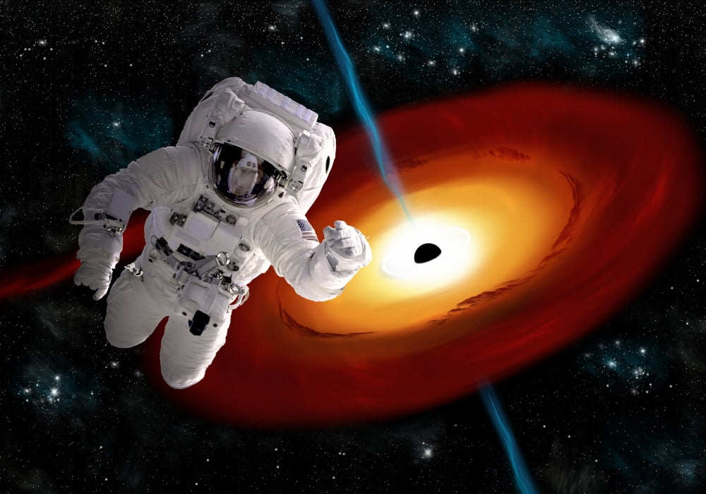 An astronaut floating in outer space as he is pulled towards a massive black hole Canvas Art - Marc WardStocktrek Images (34 x 24)