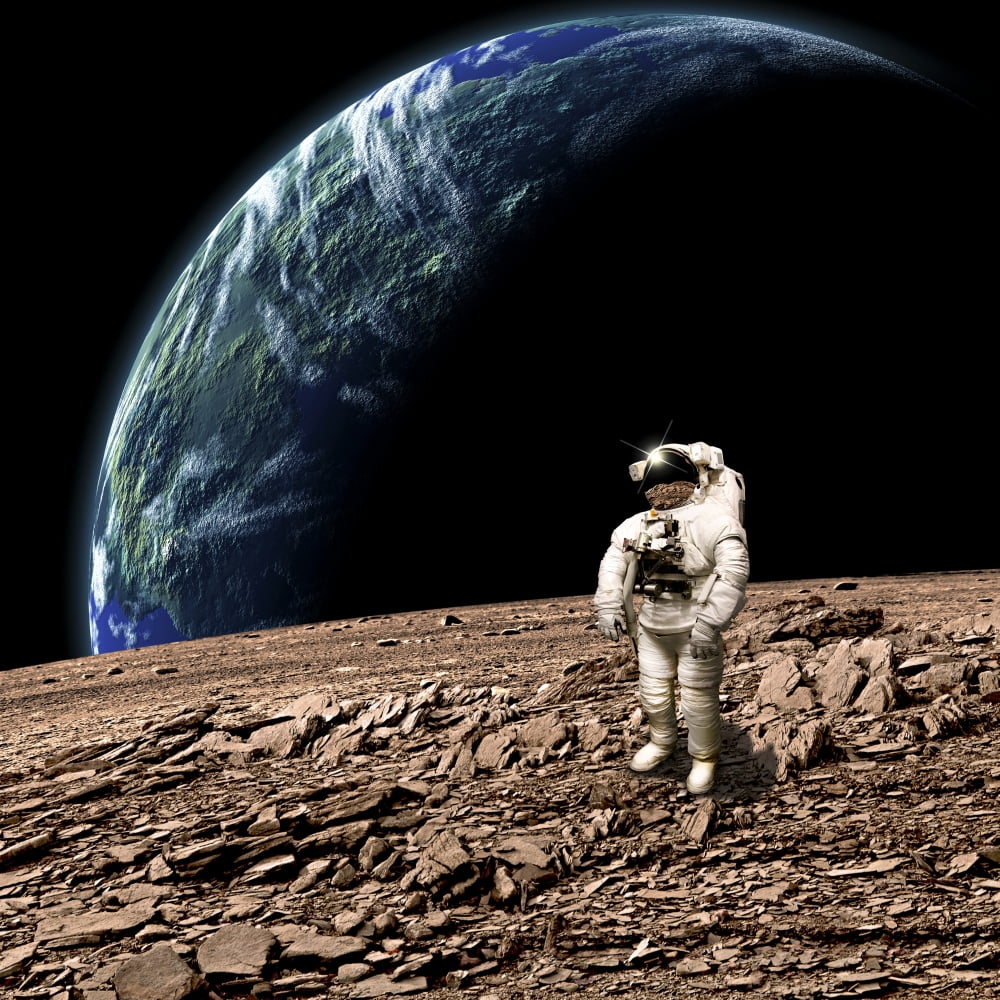 An astronaut on a barren planet with Earth-like planet in background Canvas Art - Marc WardStocktrek Images (29 x 29)