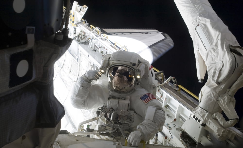An astronaut participates in a session of extravehicular activity Canvas Art - Stocktrek Images (36 x 22)
