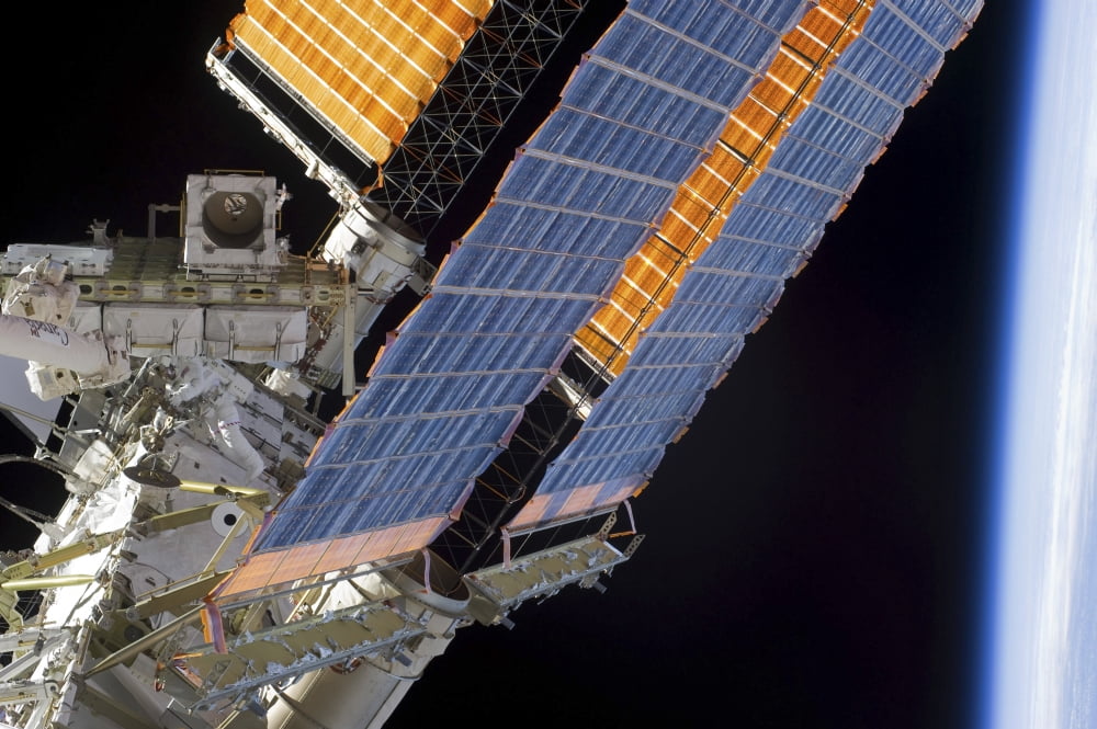An astronaut participates in a session of extravehicular activity on the International Space Station Canvas Art - Stocktrek Images (34 x 23)