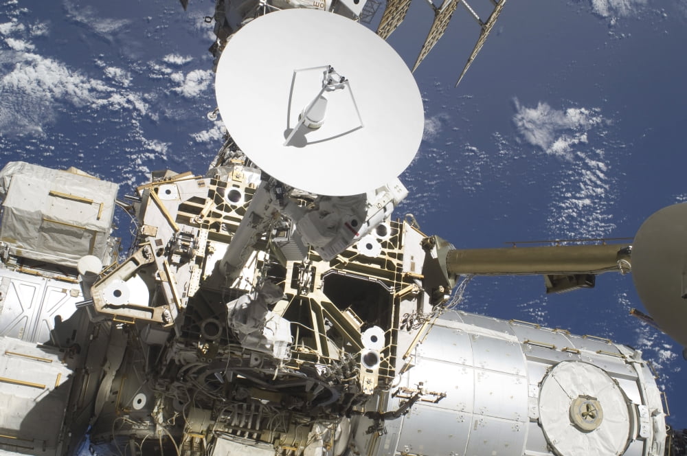 An astronaut participates in a session of extravehicular activity on the International Space Station Canvas Art - Stocktrek Images (35 x 23)