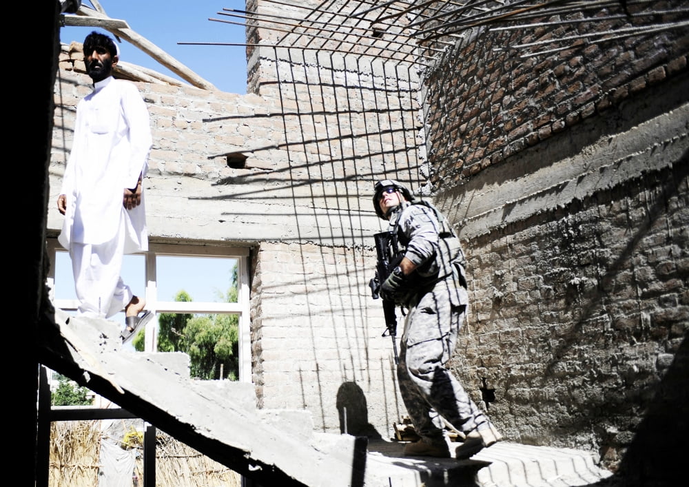 An engineer conducts a quality assurance inspection of a development site in Afghanistan Canvas Art - Stocktrek Images (34 x 24)