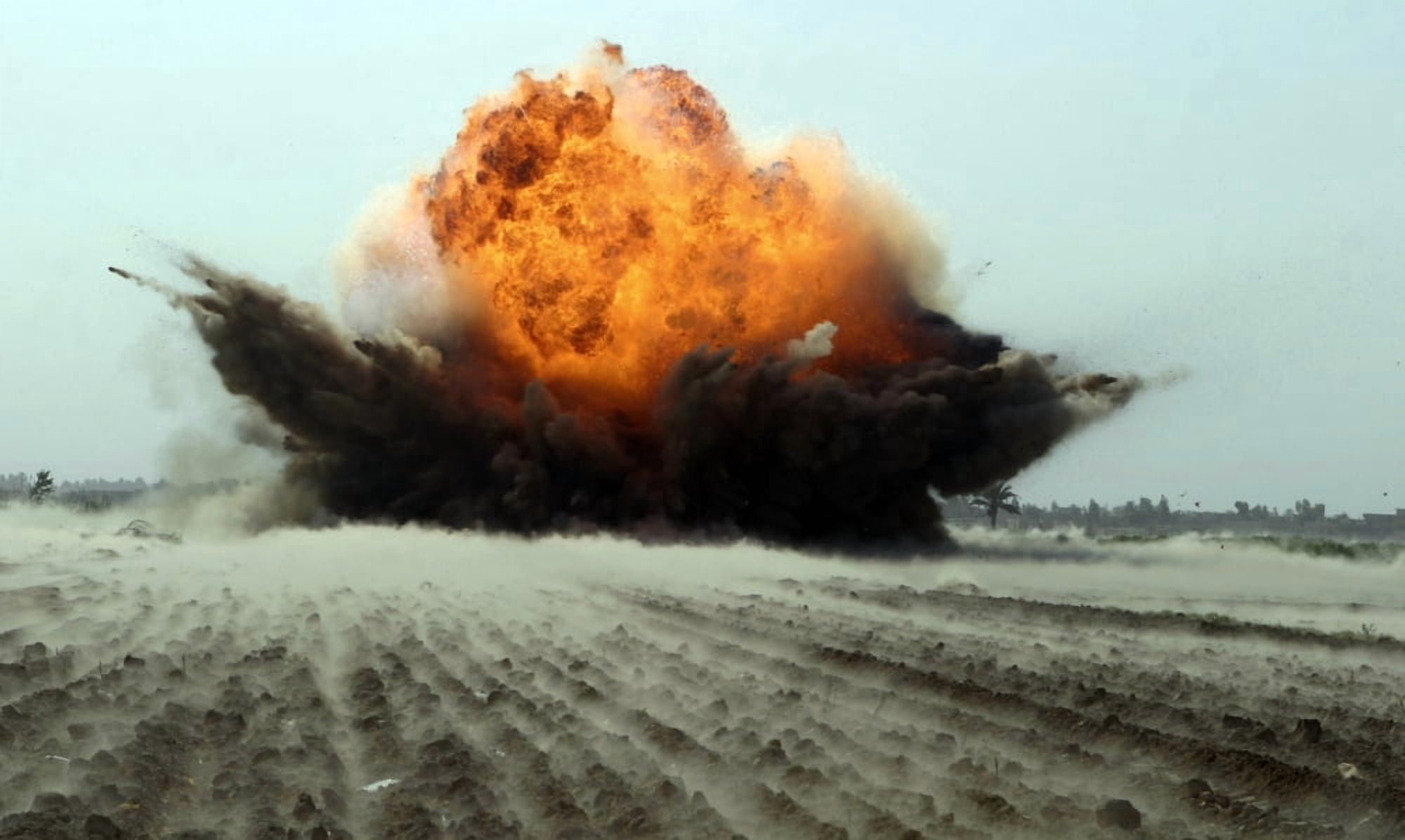 An explosion erupts from the detonation of a weapons cache Canvas Art - Stocktrek Images (36 x 22)
