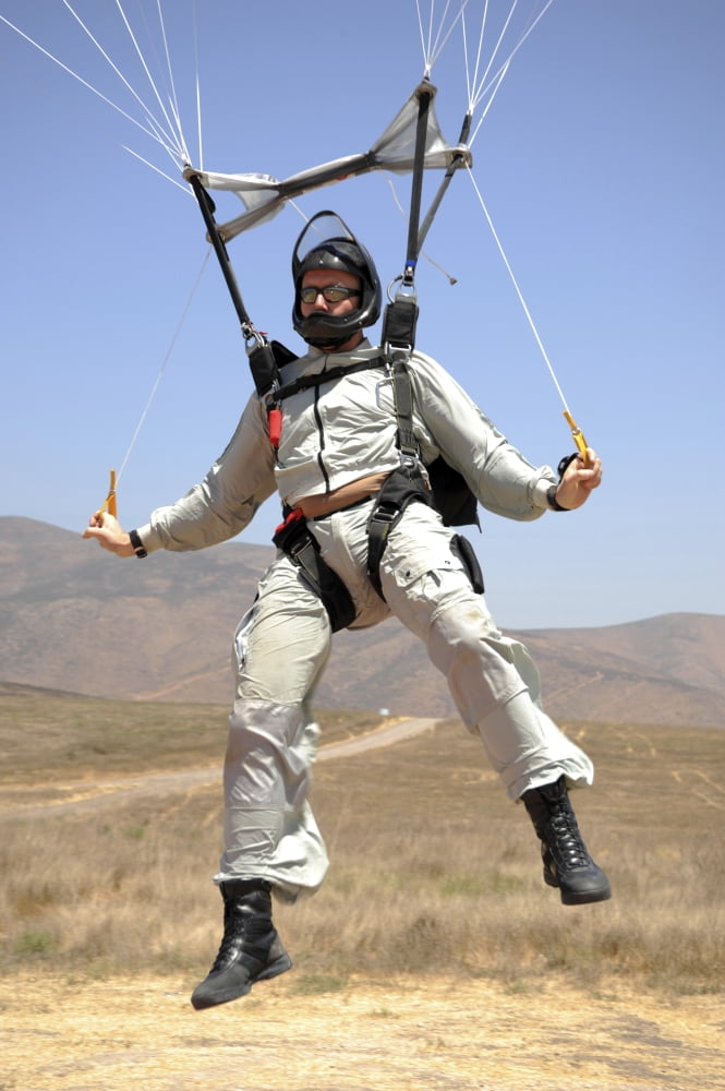 An explosive ordinance disposal technician flaring the canopy of his MT-2XX parachute Canvas Art - Stocktrek Images (23 x 34)