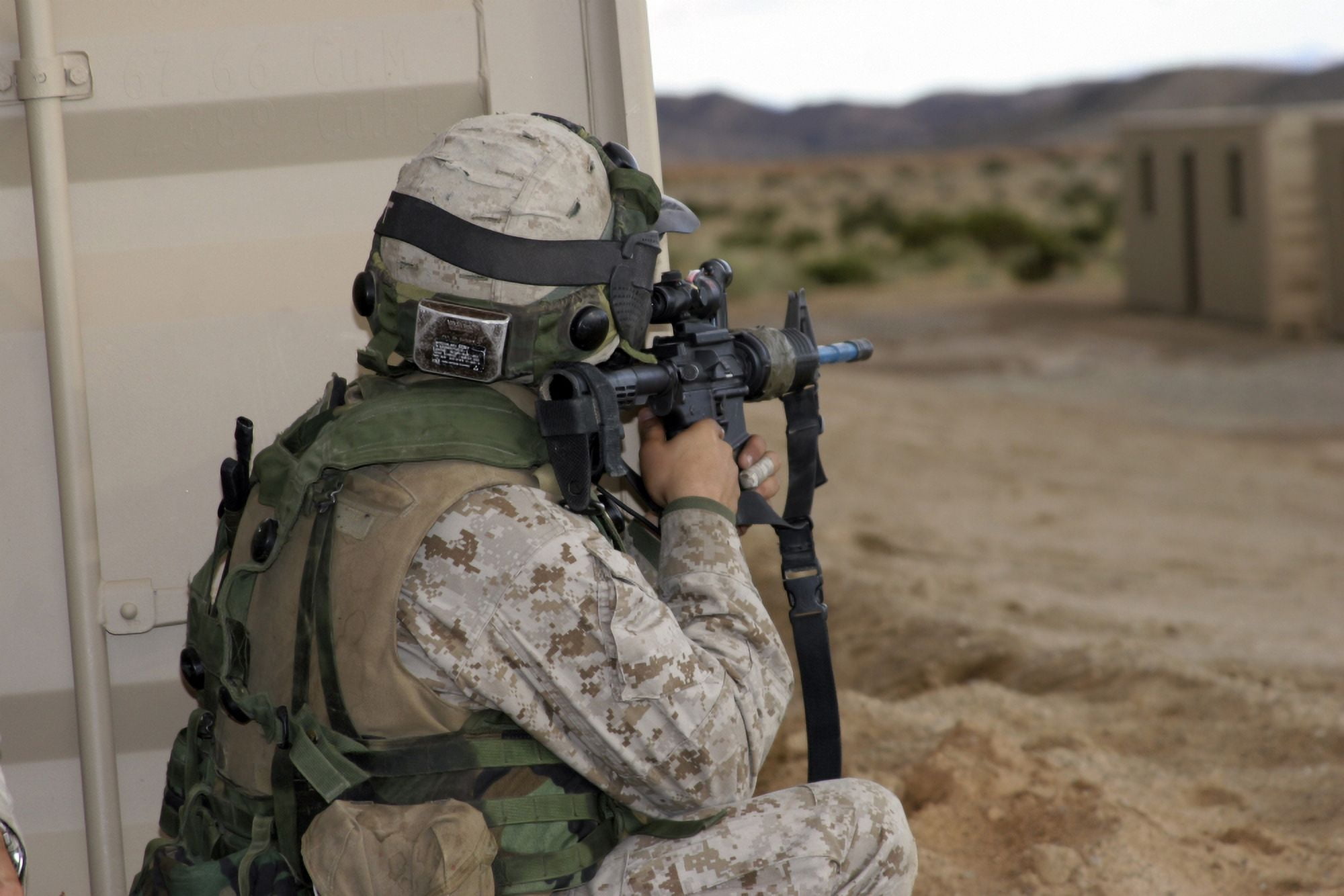 An infantry scout sights-in around the corner of a building Canvas Art - Stocktrek Images (34 x 23)