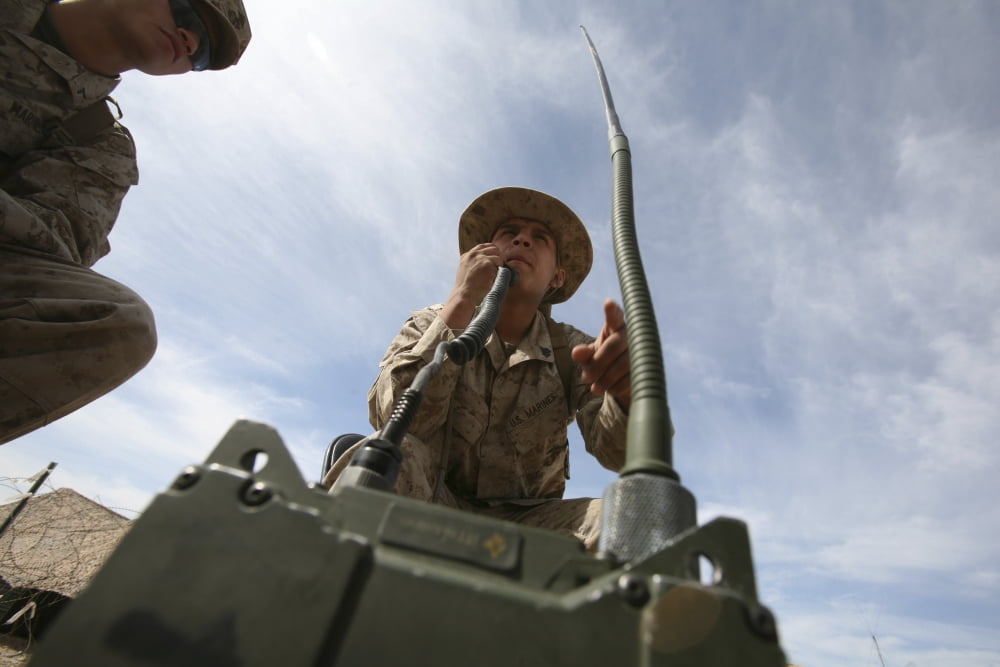An officer conducts a radio check Canvas Art - Stocktrek Images (34 x 23)