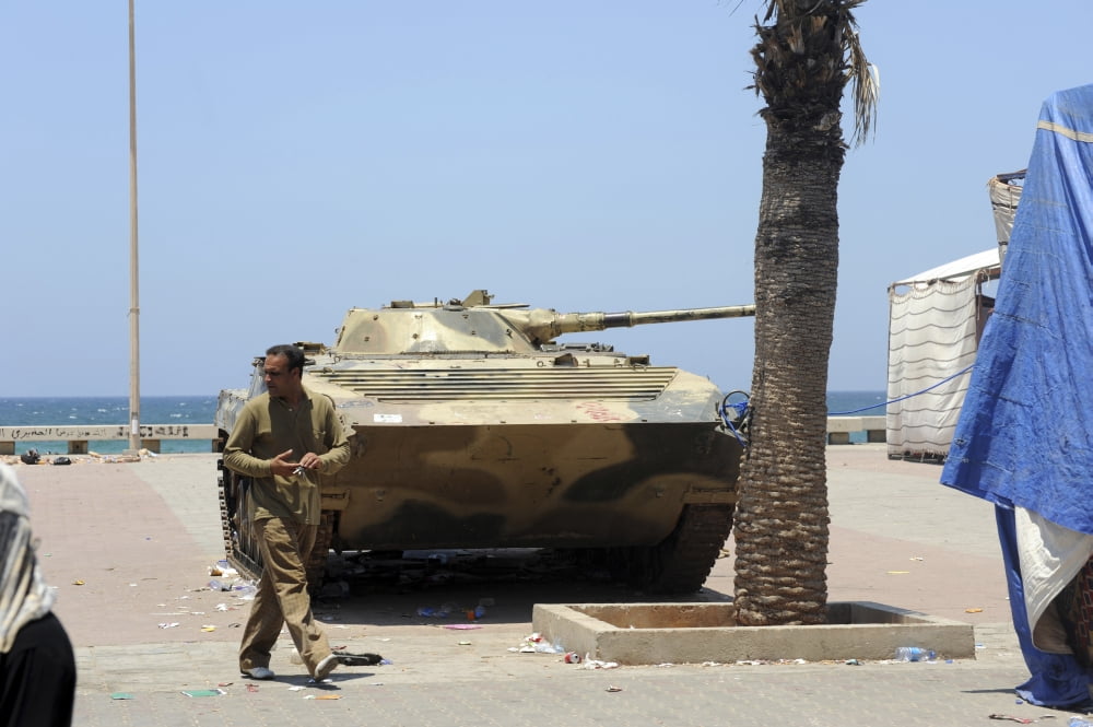 An old Russian BMP armored personnel carrier on the seafront in Benghazi Libya Canvas Art - Andrew ChittockStocktrek Images (18 x 12)