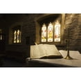 thumbnail image 1 of An open Bible on display in a church with colourful stained glass windows; Bamburgh Northumberland England, 1 of 1