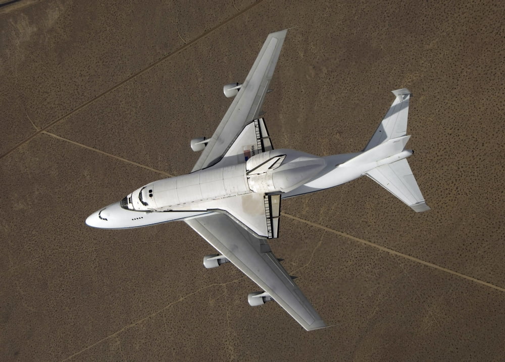 An overhead view of Space Shuttle Atlantis atop a modified 747 aircraft Canvas Art - Stocktrek Images (34 x 24)