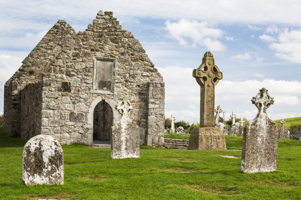 Ancient stone roofless church with celtic crosses in a grassy field County Offaly Ireland Canvas Art - Michael Interisano Design Pics (19 x 12)