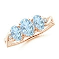 thumbnail image 1 of ANGARA Natural Oval Aquamarine Three Stone Criss-Cross Engagement Ring in 14K Rose Gold for Women (Size-7x5mm) | March Birthstone, Anniversary, Jewelry Gift for Women | Natural Aquamarine Ring, 1 of 10