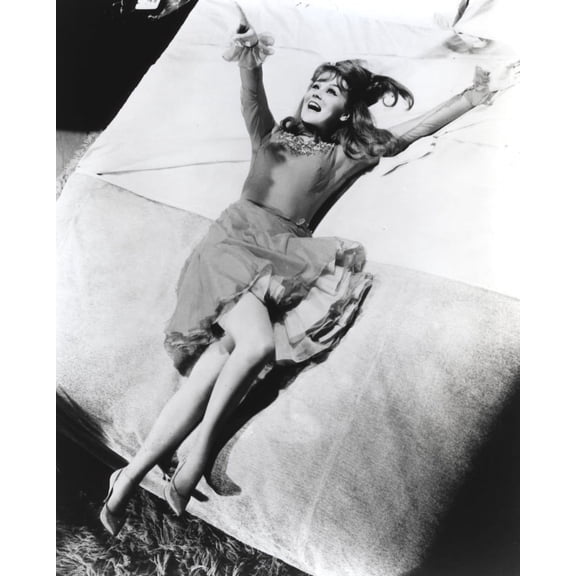 Ann-Margaret lying on a bed Photo Print (8 x 10)