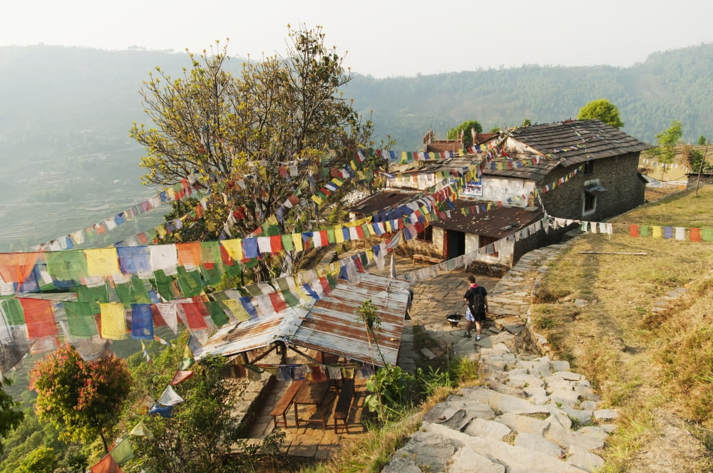 Annapurnas route in Nepal through Gandruk village a Tibetan house decorated with their traditional 5 colors Tibetan flag Gandruk Pokhara Nepal Canvas Art - Luis Martinez Design Pics (19 x 12)