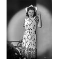 thumbnail image 1 of Anne Baxter on Printed Dress Leaning on a Post and smiling Photo Print (8 x 10), 1 of 1