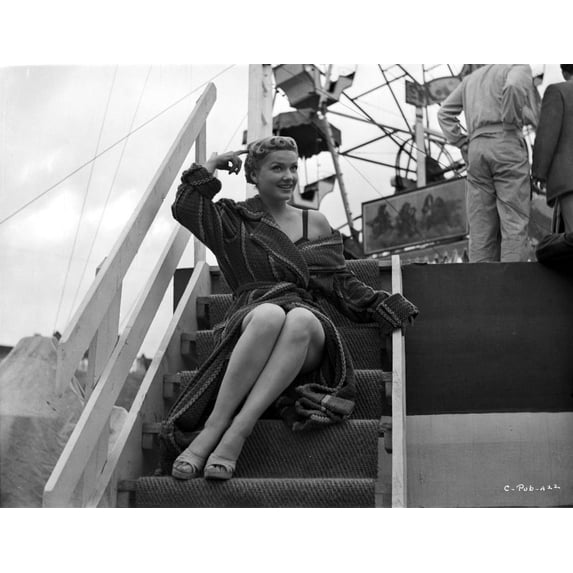 Anne Baxter on a Coat and sitting on a Stair Photo Print (24 x 30)