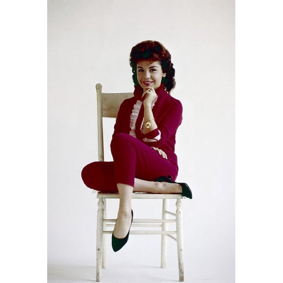 Annette Funicello sitting on white chair smiling in red outfit 24x36 Poster