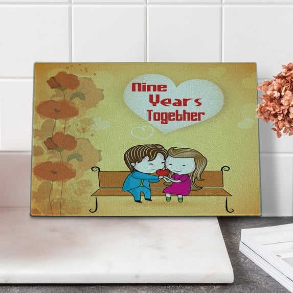 Anniversary Cutting Board, 9 Years Together Cartoon Couple Sits on a Bench with Floral Ornaments, Decorative Tempered Glass Cutting and Serving Board, in 3 Sizes, by Ambesonne