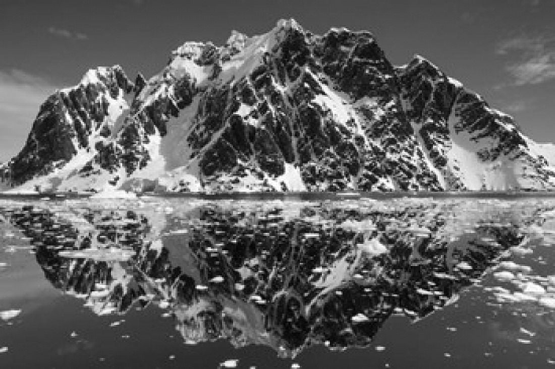 Antarctica Mountain peaks reflected in the Lemaire Channel Canvas Art - Paul Souders DanitaDelimont (18 x 12)
