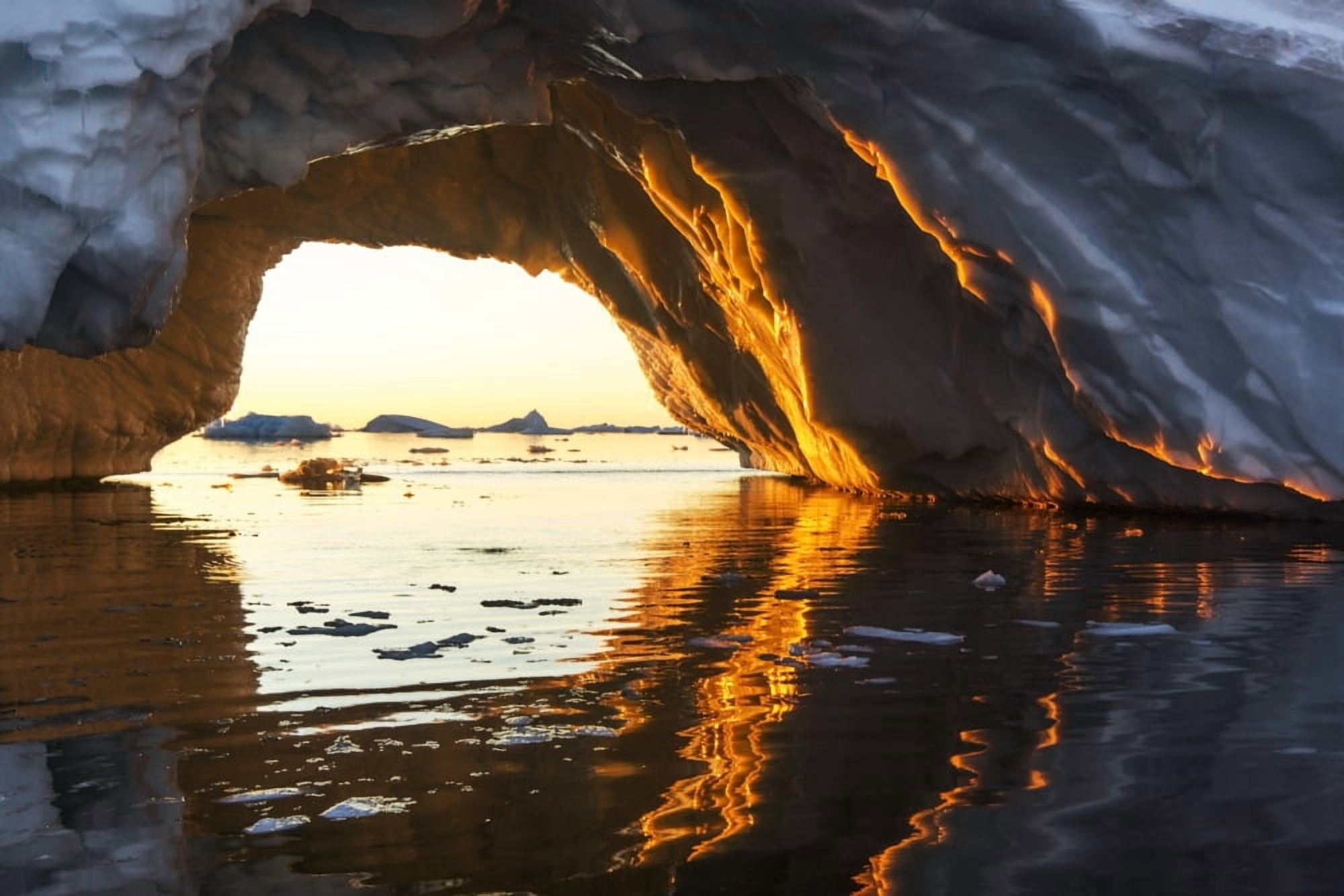 Antarctica Petermann Island Midnight sun shines through arched iceberg near Lemaire Channel Canvas Art - Paul Souders Design Pics (17 x 11)