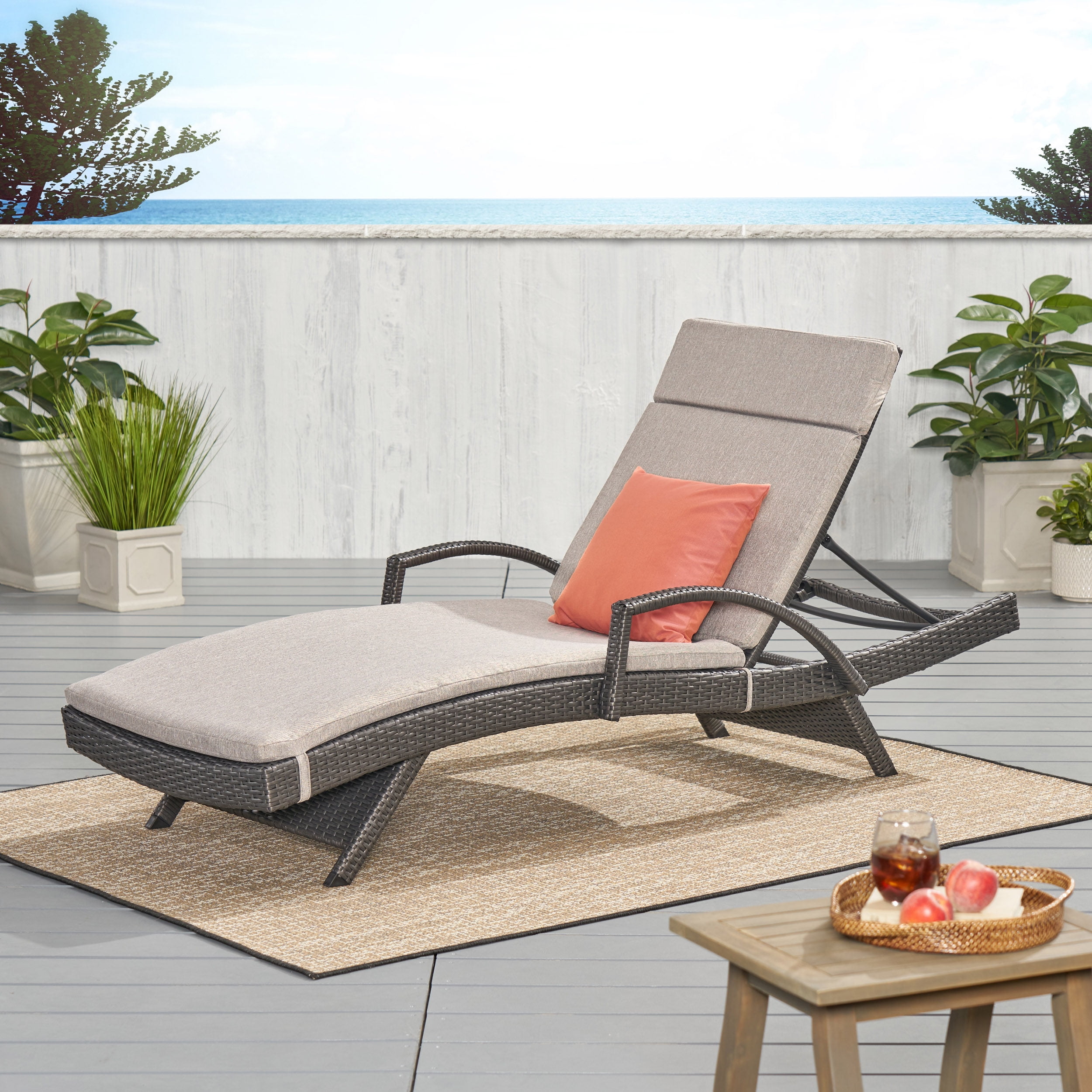 Gray Metal Outdoor Chaise Lounger with Charcoal Cushions