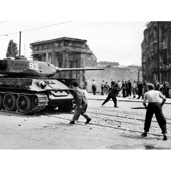Anti-Communist Riots In East Germany. An East Berliner Throws Stones At A Russian Tank During The First Violent Resistance In A Soviet Post War Satellite State. It Began With Workers' Strike Over