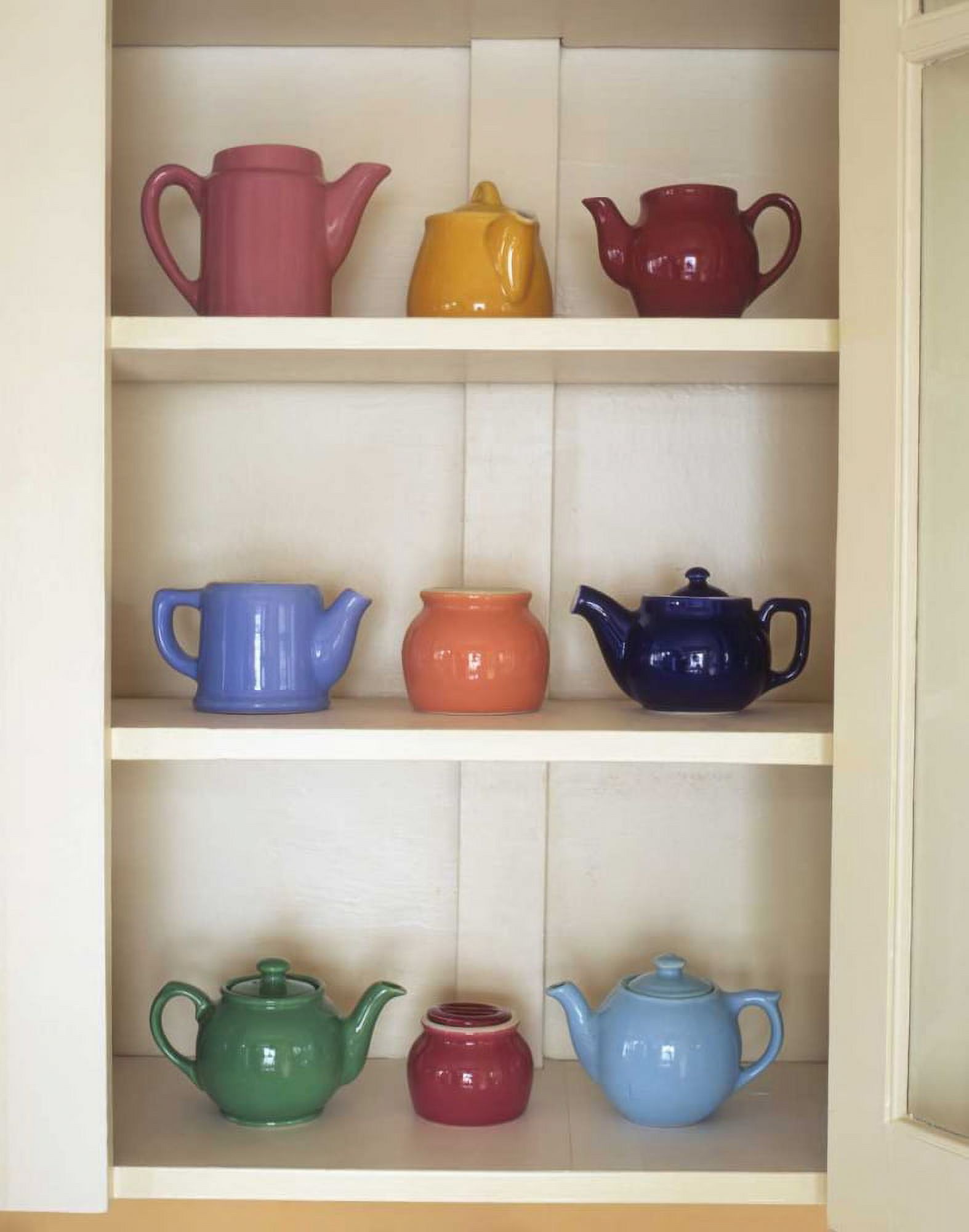 Antique ceramic teapots and sugar bowls in cupboard by Steve Terrill (18 x 24) - image 1 of 1