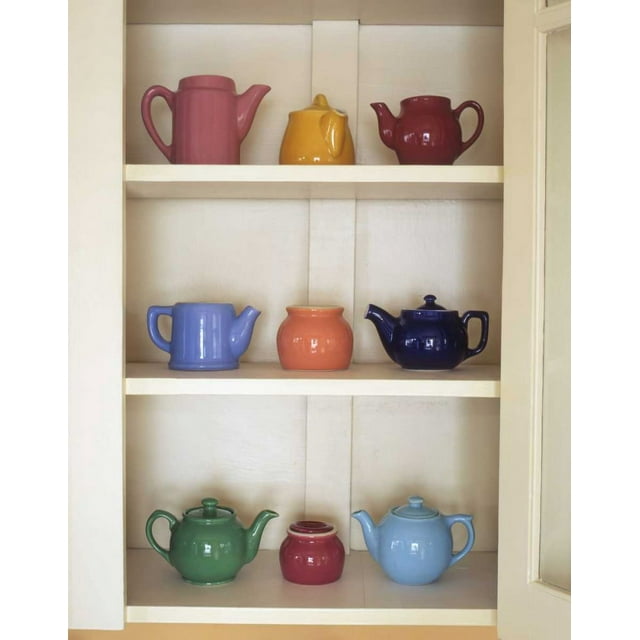 Antique ceramic teapots and sugar bowls in cupboard by Steve Terrill (18 x 24)