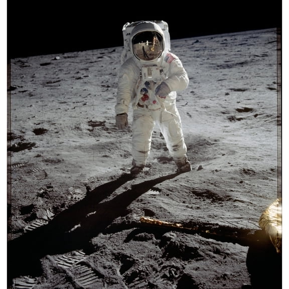 Apollo 11 Astronaut Edwin Aldrin On The Moon. Neil Armstrong And The Lunar Module Are Reflected In Aldrin'S Gold Visor.