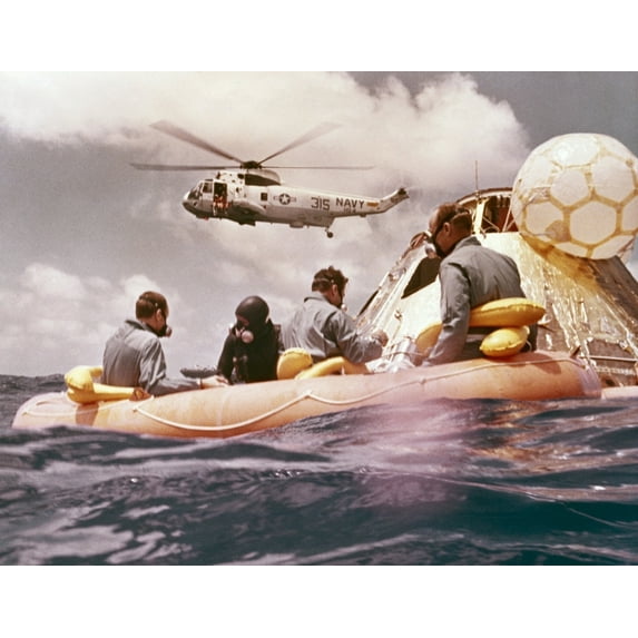 Apollo 12 Pacific Recovery. Astronauts Are In A Life Raft Near The Command Module With A Helicopter Hovering Above. Nov.