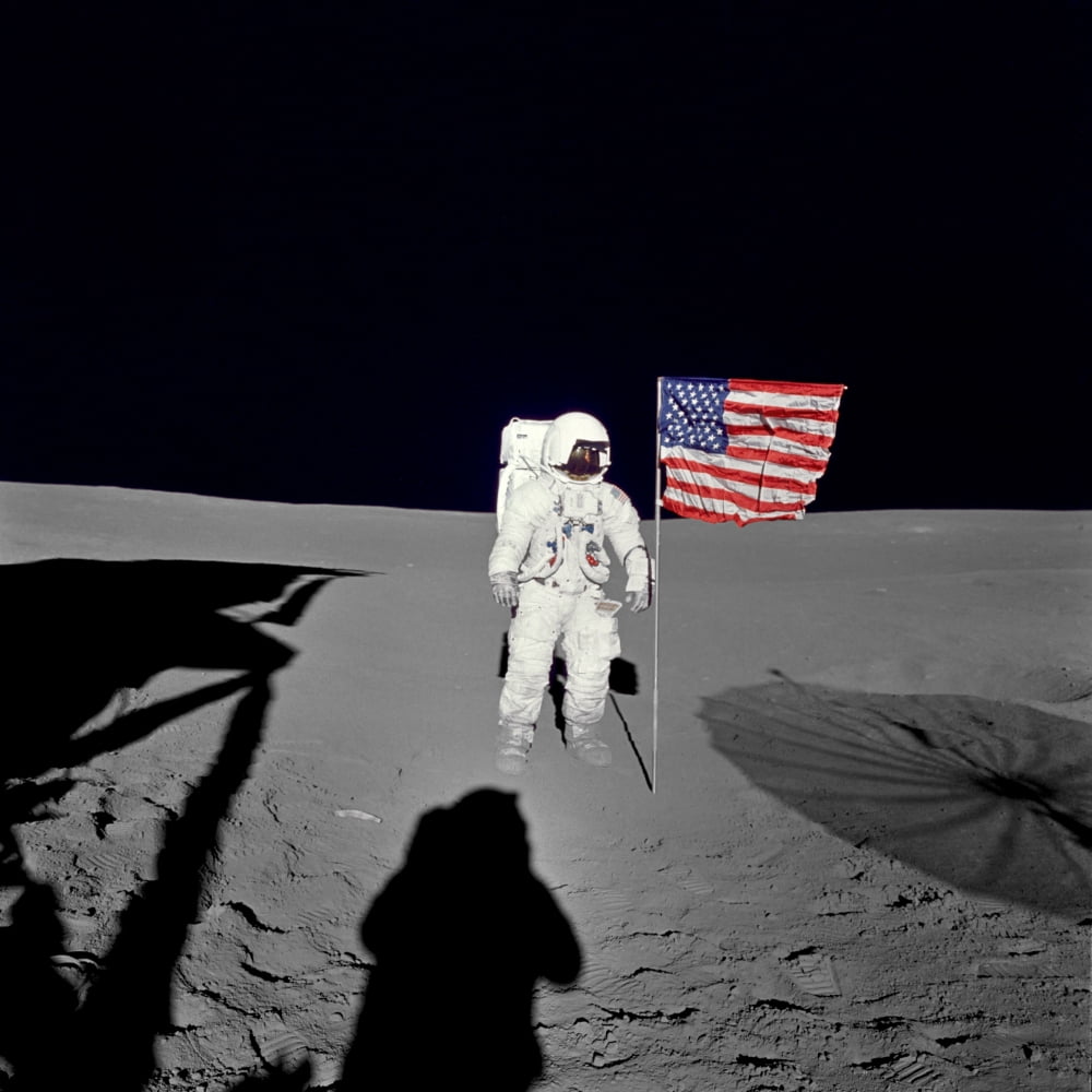 Apollo 14 astronaut stands by the American flag on the lunar surface Canvas Art - Stocktrek Images (28 x 28)