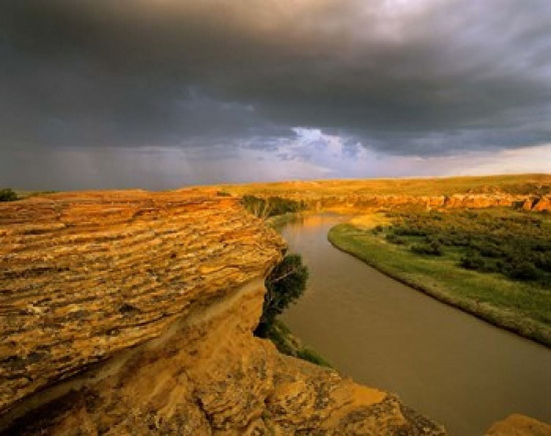 Approaching storm on the Milk River at Writing on Stone Provincial Park Alberta Canada Canvas Art - Chuck Haney DanitaDelimont (30 x 24)