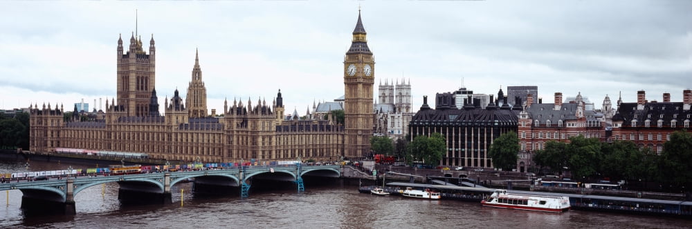 Arch bridge across a river Westminster Bridge Big Ben Houses Of Parliament Westminster London England Canvas Art - Panoramic Images (27 x 9)