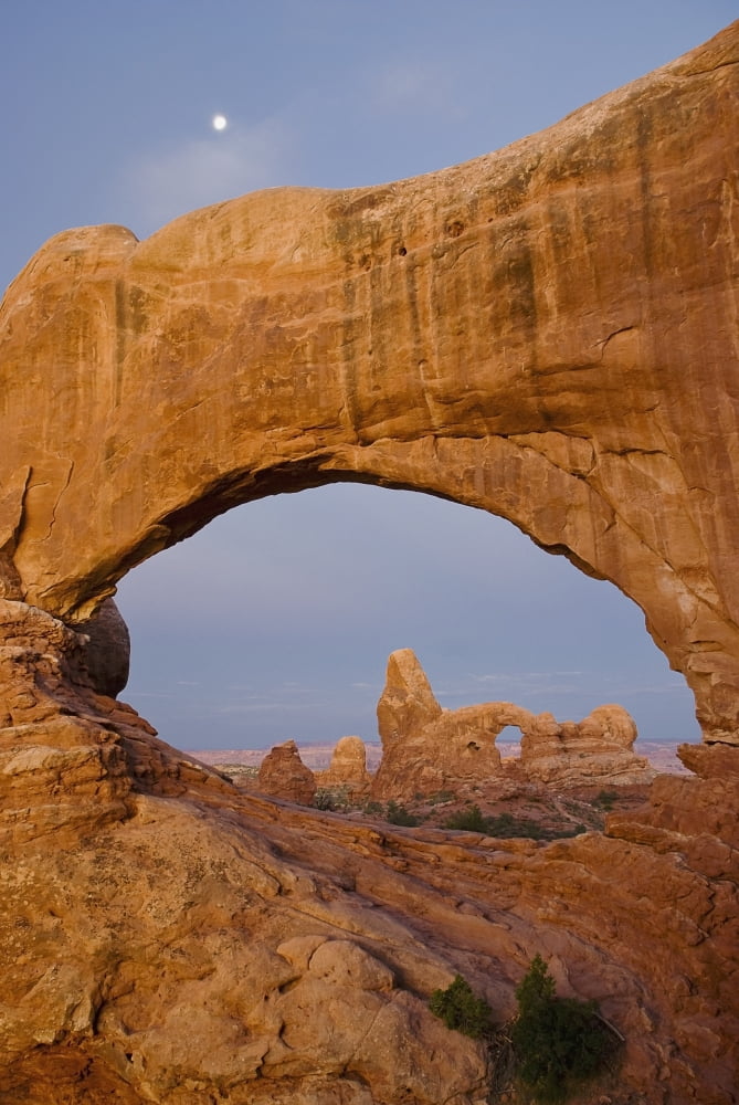 Arches National Park Utah United States Of America Turret Arch Seen Through The North Window At Sunrise With A Full Moon Above Canvas Art - Philippe Widling  Design Pics (12 x 19)