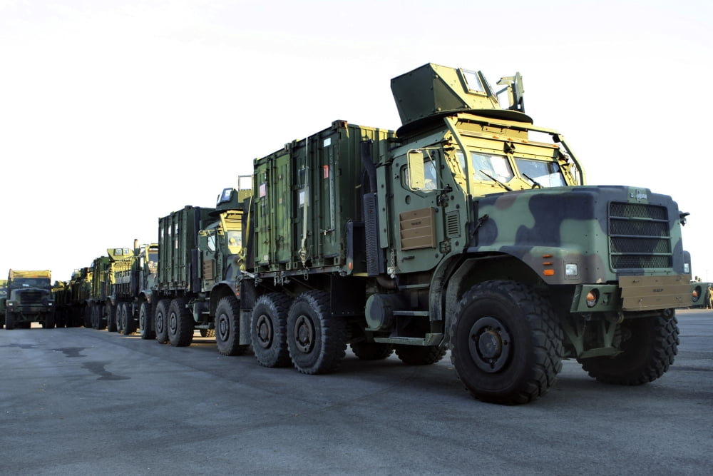 Armored trucks sit on the pier at Morehead City North Carolina awaiting deployment Canvas Art - Stocktrek Images (35 x 23)