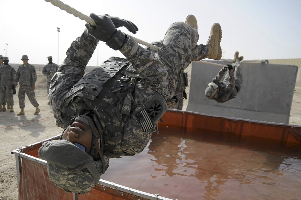 Army Specialist uses a 15 foot rope to cross a water obstacle Canvas Art - Stocktrek Images (34 x 23)