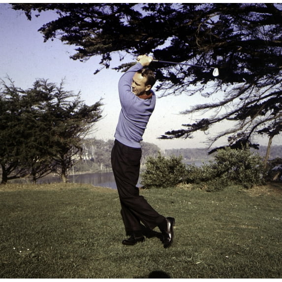 Arnold Palmer with golf club. Photo Print (30 x 24)