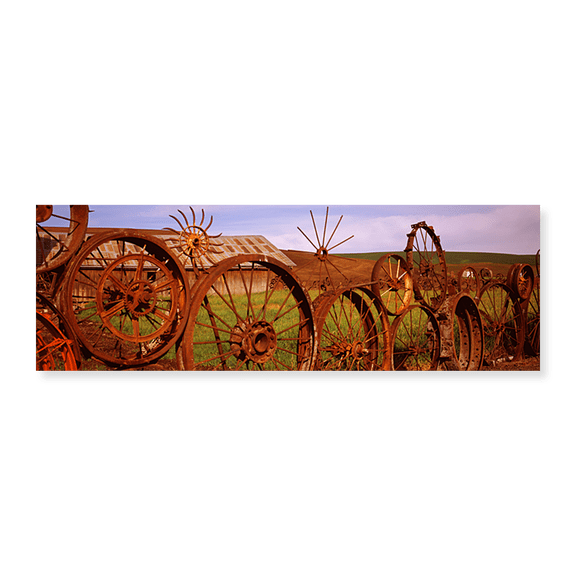 Art Print (Unframed), Old barn with a fence made of wheels by Panoramic Images, 24" x 8"