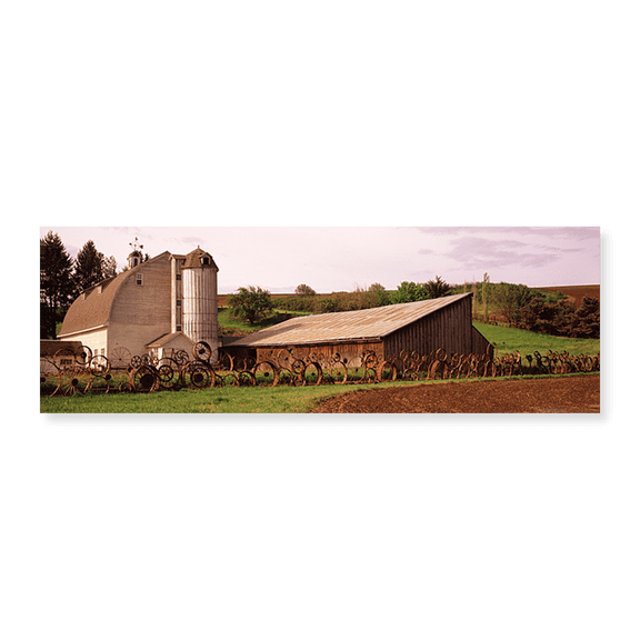 Art Print (Unframed), Old barn with a fence made of wheels by Panoramic Images, 24" x 8"